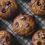 Chocolate chip cookies with sea salt on cooling rack
