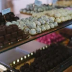 a display case filled with lots of different types of chocolates